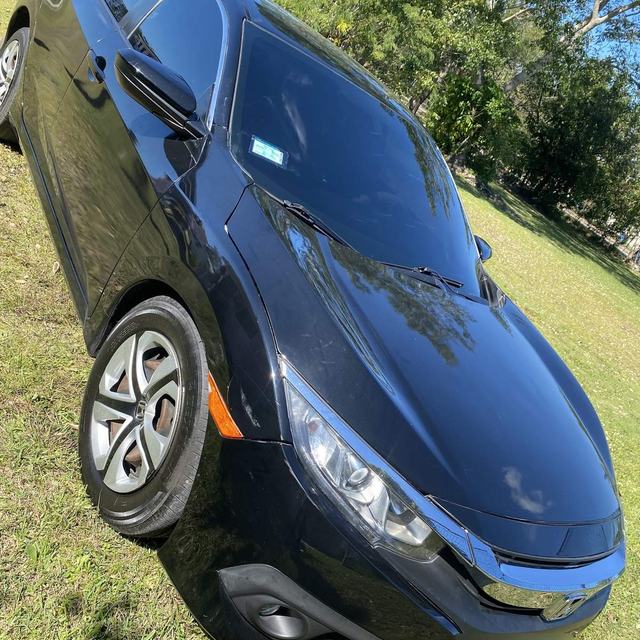 Black Honda sedan, tinted