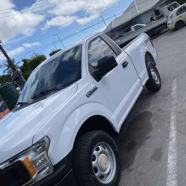 White pickup with tinted windows